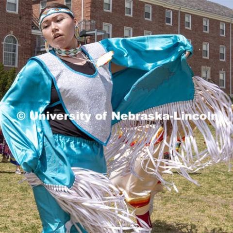 Fringe on the regalia of Stevie Horse, a member of the Ponca and Lakota tribe, flutters in the wind as she dances during an intertribal moment at the April 23 powwow. 2022 UNITE powwow to honor graduates (K through college). Held April 23 on the greenspace along 17th Street, immediately west of the Willa Cather Dining Center. This was UNITE’s first powwow in three years. The MC was Craig Cleveland Jr. Arena director was Mike Wolfe Sr. Host Northern Drum was Standing Horse. Host Southern Drum was Omaha White Tail. Head Woman Dancer was Kaira Wolfe. Head Man Dancer was Scott Aldrich. Special contest was a Potato Dance. April 23, 2023. Photo by Troy Fedderson / University Communication.